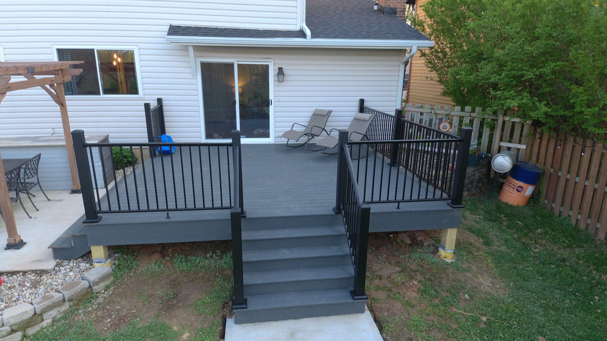 Raised gray deck with black railings